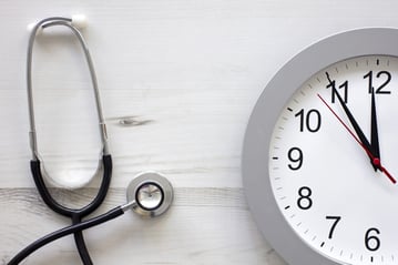 Concept showing doctors stethoscope and a clock face simulating an appointment.jpeg